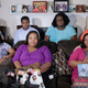 Tia Coleman, middle seated, speaks as she is surrounded by family members during a news conference at her home, Tuesday, Aug. 14, 2018, Indianapolis. Seventeen people died when the boat sank during a July 19 storm near Branson, Missouri, including 40-year-old Glenn Coleman, 9-year-old Reece, 7-year-old Evan and 1-year-old Arya. Five other Coleman relatives also died.